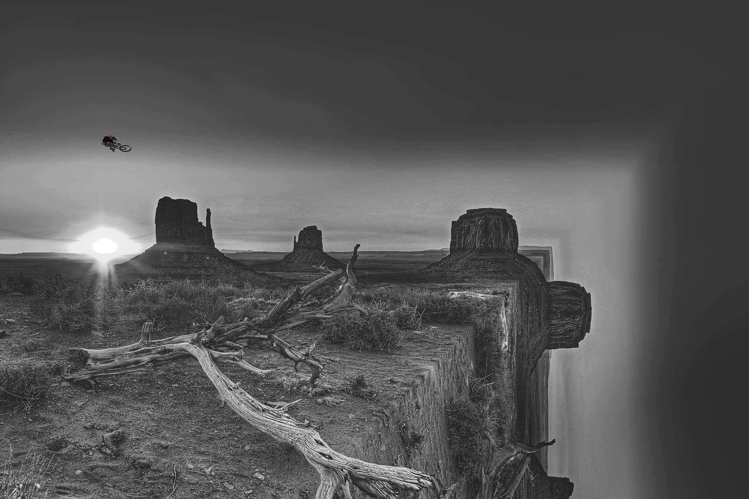 Monument Valley Navajo mountain biker BW Jumps the edge of the world Wick Beavers Photographer